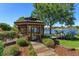 Screened gazebo on the lake with pavers and tropical landscaping at 2828 Marquesas Ct, Windermere, FL 34786