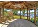 Interior view of the gazebo with ceiling fan and views of the lake and landscaping at 2828 Marquesas Ct, Windermere, FL 34786