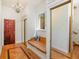 Bright hallway features hardwood floors and a built-in bench with storage at 2828 Marquesas Ct, Windermere, FL 34786