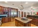 Spacious kitchen featuring a large island, stainless steel appliances, and custom cabinetry at 2828 Marquesas Ct, Windermere, FL 34786