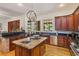 Gourmet kitchen featuring stone countertops, custom cabinets and stainless appliances at 2828 Marquesas Ct, Windermere, FL 34786