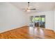 Bright living room featuring hardwood floors and sliding doors leading to the patio at 2828 Marquesas Ct, Windermere, FL 34786
