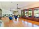 Bright living room boasts wood floors, ceiling fans, and French doors to the outside at 2828 Marquesas Ct, Windermere, FL 34786