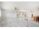 Spacious and airy living room with marble floors, stairs to other levels and a large window at 2828 Marquesas Ct, Windermere, FL 34786