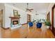 Spacious living room with a fireplace, hardwood floors, and elegant ceiling fans at 2828 Marquesas Ct, Windermere, FL 34786