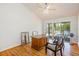 Office featuring hardwood floors, vaulted ceiling, and sliding doors leading to the patio at 2828 Marquesas Ct, Windermere, FL 34786