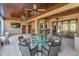 Large covered patio with brick accents, ideal for entertaining with ample seating at 2828 Marquesas Ct, Windermere, FL 34786