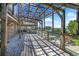 Spacious outdoor patio area with glass railings offering scenic lake views at 2828 Marquesas Ct, Windermere, FL 34786