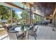 Elegant enclosed patio featuring dining, spiral staircase, and a view of the pool at 2828 Marquesas Ct, Windermere, FL 34786