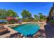 A backyard pool with a jacuzzi, brick surround, and views of the gazebo and lake at 2828 Marquesas Ct, Windermere, FL 34786