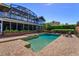Backyard pool and spa with brick surround and an enclosed patio adjacent to the house at 2828 Marquesas Ct, Windermere, FL 34786