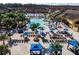 Aerial view of a resort-style pool with ample deck seating, perfect for outdoor relaxation and enjoyment at 2919 Banana Palm Dr, Kissimmee, FL 34747