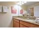 Bathroom featuring double vanity with granite countertop, and shower and tub at 2919 Banana Palm Dr, Kissimmee, FL 34747