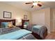 Shared bedroom with two beds, ceiling fan, window and closet at 2919 Banana Palm Dr, Kissimmee, FL 34747