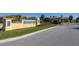 Community entrance featuring attractive sign and access gate for Paradise Palms Resort at 2919 Banana Palm Dr, Kissimmee, FL 34747