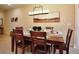 Dining room with seating for six and an attractive chandelier at 2919 Banana Palm Dr, Kissimmee, FL 34747