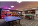Spacious game room with pool tables and arcade games at 2919 Banana Palm Dr, Kissimmee, FL 34747