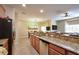 Kitchen featuring granite countertops, stainless steel appliances, and seating at the breakfast bar at 2919 Banana Palm Dr, Kissimmee, FL 34747