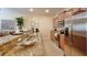 Kitchen featuring stainless steel appliances, granite countertops, and breakfast bar with seating at 2919 Banana Palm Dr, Kissimmee, FL 34747