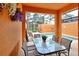 Covered patio with table, seating, and view of the pool at 2919 Banana Palm Dr, Kissimmee, FL 34747