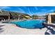 Bright community pool with an inviting waterfall feature, sunny lounge area, and ample seating at 2919 Banana Palm Dr, Kissimmee, FL 34747