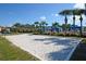 Well-manicured sand volleyball court, next to a pool and community area at 2919 Banana Palm Dr, Kissimmee, FL 34747