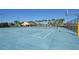 Beautiful community tennis court with palm trees and community center nearby at 2919 Banana Palm Dr, Kissimmee, FL 34747