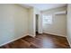 Bedroom with hardwood floors, a closet and mini split AC unit at 3025 Bon Air Dr, Orlando, FL 32818