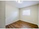 A bright bedroom with a window and hardwood floors at 3025 Bon Air Dr, Orlando, FL 32818