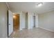 Spacious bedroom featuring tile flooring, closet, and a view into the en-suite bathroom at 3025 Bon Air Dr, Orlando, FL 32818