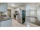 Modern kitchen featuring stainless steel appliances and sleek countertops, and open to the living area at 3025 Bon Air Dr, Orlando, FL 32818