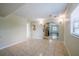Inviting living room featuring tile flooring and an archway leading to other living areas at 3025 Bon Air Dr, Orlando, FL 32818