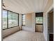 This enclosed porch features tile flooring, plenty of light and a view at 3025 Bon Air Dr, Orlando, FL 32818