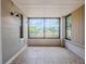 Enclosed porch with large windows offering an abundance of natural light and views at 3025 Bon Air Dr, Orlando, FL 32818
