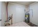 Functional utility room featuring water heater and connections for washer and dryer at 3025 Bon Air Dr, Orlando, FL 32818