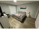 Cozy bedroom with new flooring, modern decor, and a calming color palette at 3147 Britannia Blvd # A, Kissimmee, FL 34747