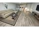 Comfortable living room with modern decor, dining table, and hard surface floors at 3147 Britannia Blvd # A, Kissimmee, FL 34747