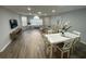 Open-concept living and dining area with sleek furniture and lots of natural light at 3147 Britannia Blvd # A, Kissimmee, FL 34747