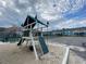 Community playground with a play structure, slide, and climbing net for children at 3147 Britannia Blvd # A, Kissimmee, FL 34747