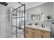 Updated bathroom with double sink vanity, marble countertops, tiled shower and glass enclosure at 320 Lakeview St # 214, Orlando, FL 32804