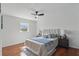 Inviting bedroom featuring wood floors, stylish lamps and rug, and a comfortable upholstered headboard at 320 Lakeview St # 214, Orlando, FL 32804