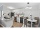 Updated kitchen with stainless steel appliances, stone countertops, and dining table at 320 Lakeview St # 214, Orlando, FL 32804