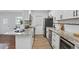 Stylish kitchen featuring updated appliances, stone countertops, and white cabinetry at 320 Lakeview St # 214, Orlando, FL 32804