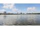 Scenic lake view with buildings and a bridge in the background on a sunny day with scattered clouds at 320 Lakeview St # 214, Orlando, FL 32804