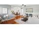 Bright living room featuring hardwood floors, neutral paint and decor and kitchen access at 320 Lakeview St # 214, Orlando, FL 32804