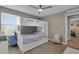 Well-lit bedroom featuring a cozy bunk bed with a chair and minimalist decor at 320 Primrose Dr, Davenport, FL 33837