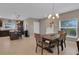 Dining room with table set for four and chandelier at 320 Primrose Dr, Davenport, FL 33837
