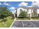 Attractive townhome with a lush lawn and carefully placed landscaping in a well-maintained community and parking at 320 Primrose Dr, Davenport, FL 33837