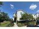 Two-story home with green door and landscaping, situated near neighborhood at 320 Primrose Dr, Davenport, FL 33837