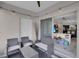 Relaxing screened-in lanai with seating and access to the home's interior at 320 Primrose Dr, Davenport, FL 33837